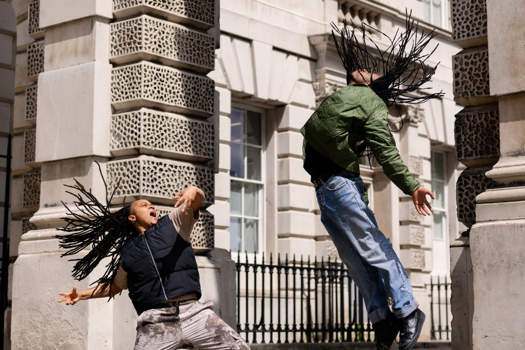 Two dancers in Somerset House with expressive dance poses